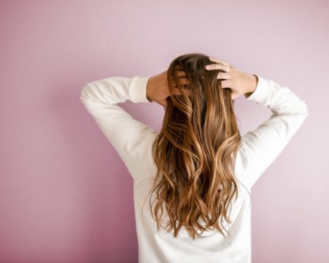 woman wearing white long sleeved shirt