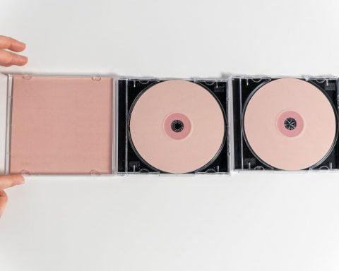 a compact discs on white surface